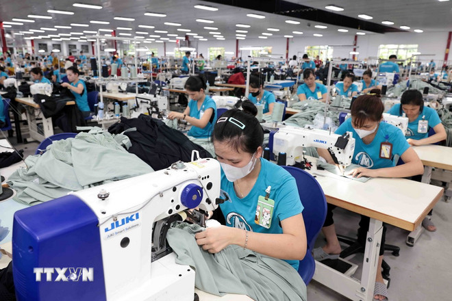 Ngành dệt may là một trong những động lực chính của toàn ngành công nghiệp. (Ảnh: Trần Việt/TTXVN) ttxvn-san-xuat-cong-nghiep-2.jpg